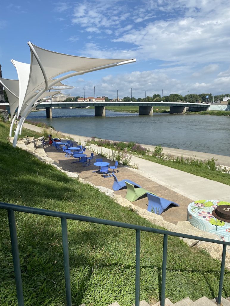 Chairs and tables alongside the river at the Riverscape Metro Park in downtown Dayton.