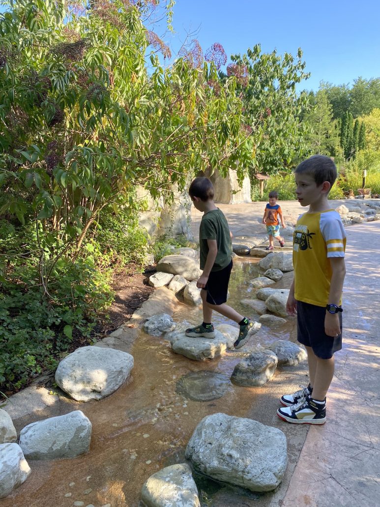 Boys playing in the creek at Wegerzyn Gardens in Dayton, Ohio.