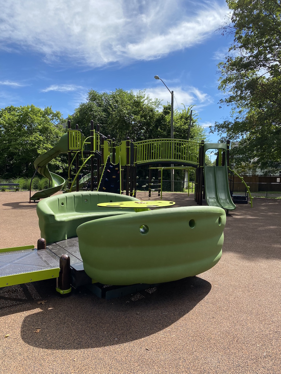 Accessible glider at the playground at Garrette Park.