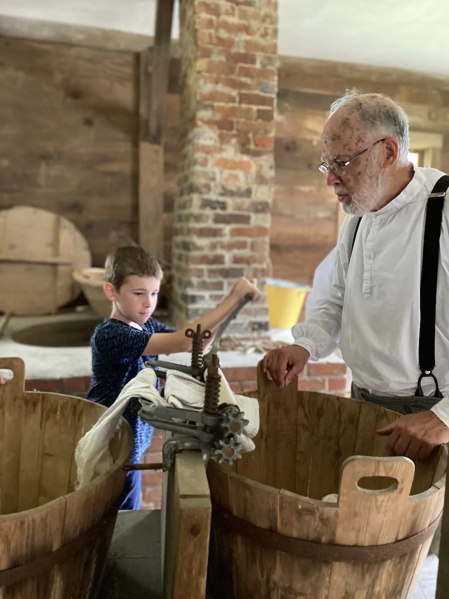 Boy learning how laundry was done in Zoar Village.