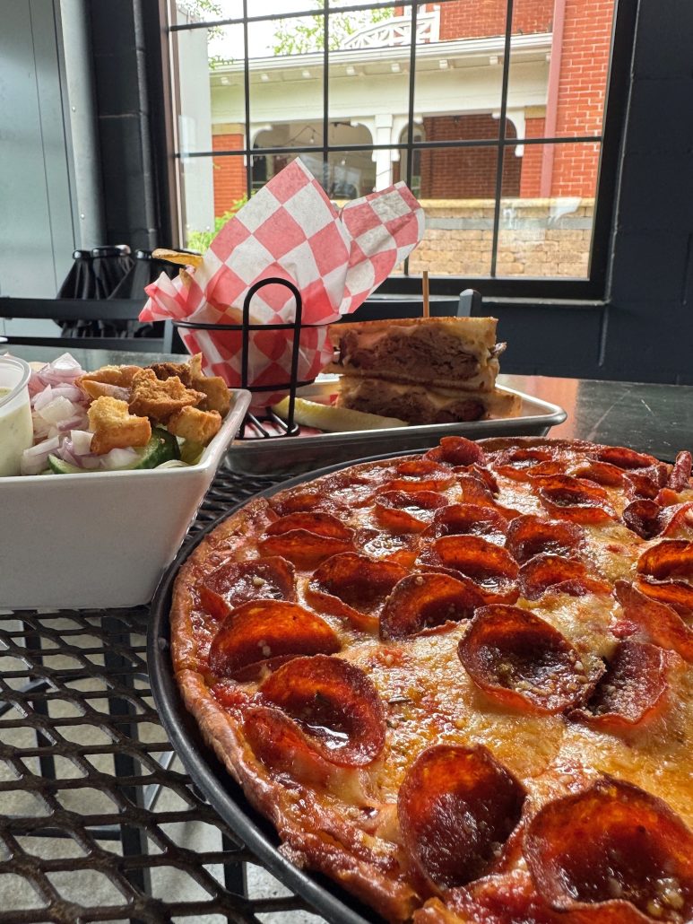 Pizza, salad and a sandwhich at Leon's Garage in Marysville, Ohio.