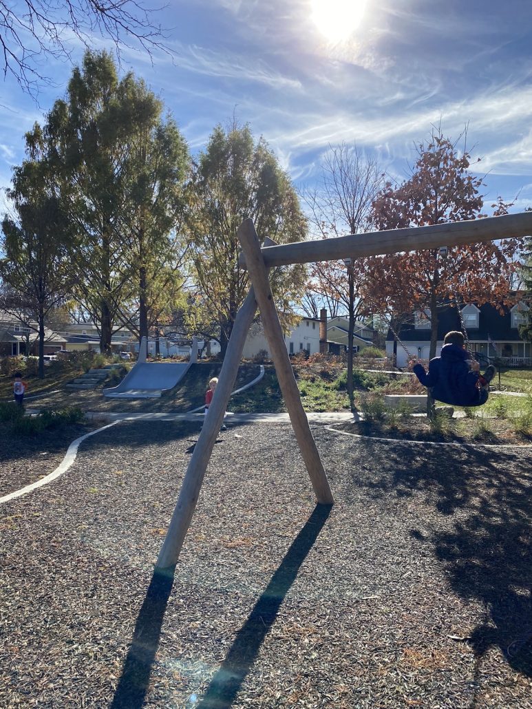 Swings and a slide at a playground in Worthington, Ohio.