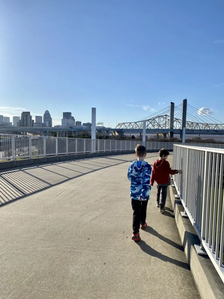 Two boys walking on the Louisville side of the Big Four Bridge to Indiana.