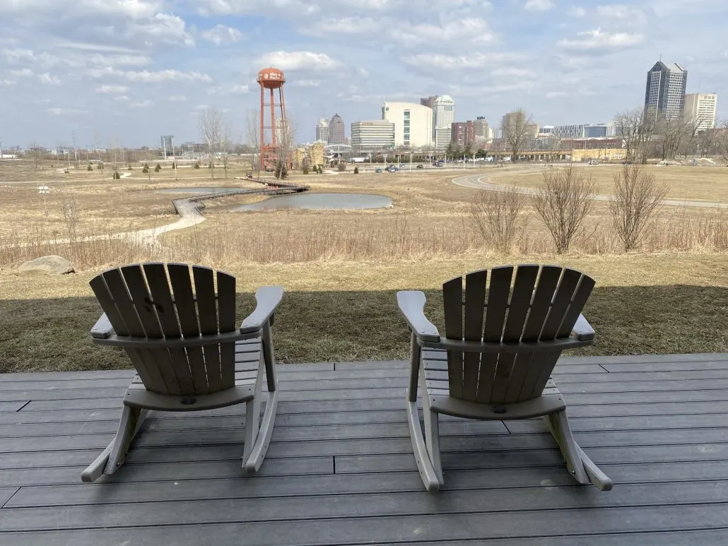 Two chairs on the deck of the Scioto Audubon overlooking downtown Columbus, Ohio, a great date spot.