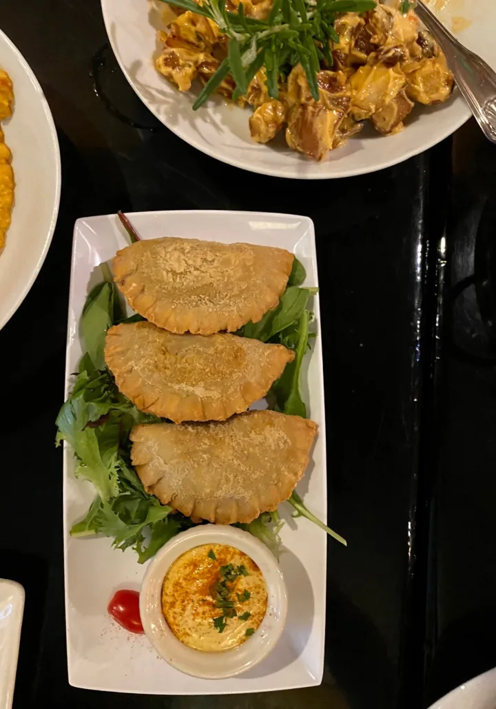Empanadas and potatoes, vegetarian dishes at Sidebar, a restaurant in downtown Columbus.