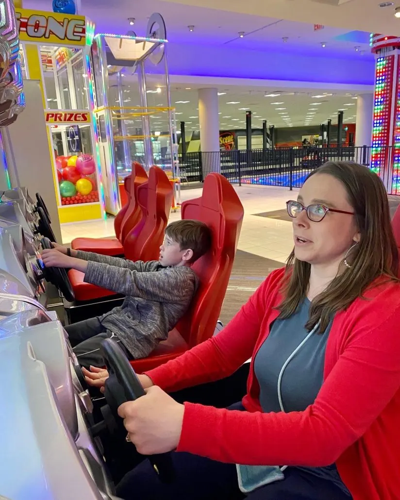 A mom and son playing video games at Scene 75, an indoor entertainment center near Dublin, Ohio.