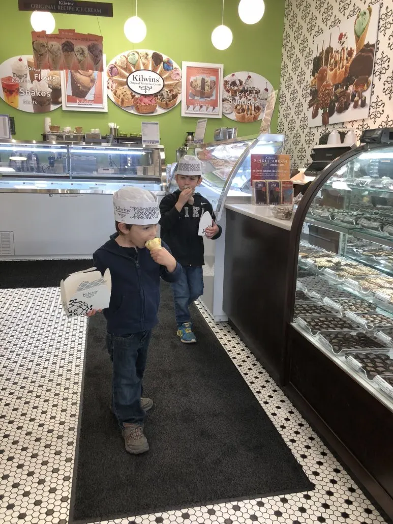 Two boys eating ice cream at Kilwins, a chocolate shop in Dublin, Ohio.