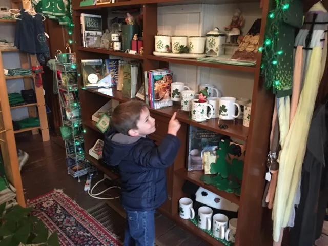 A boy finding a hidden elf on the 12 Elves of Dublin Trail, a fun thing to do with kids in Dublin, Ohio.