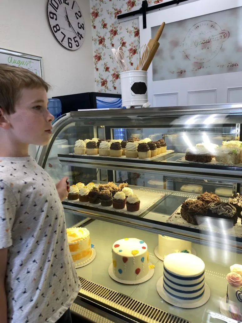 A boy in front of the bakery case at Mrs. Goodman's in Worthington, Ohio.