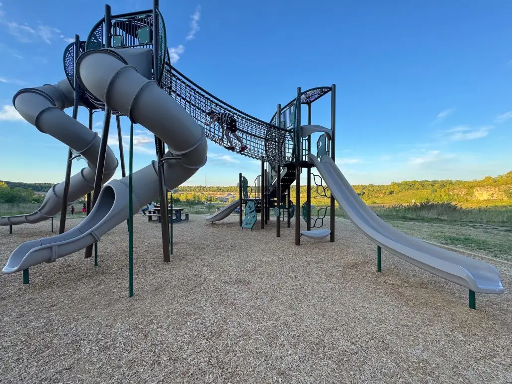 With a beautiful waterfall, a floating boardwalk, a zip line and a mountain bike trail, Quarry Trails Metro Park will keep your whole family entertained! Quarry Trails Metro Park was created out of an abandoned quarry (Marble Cliff Quarry) on the west side of Columbus. The park is the 20th park in the Columbus and Franklin County Metro Parks system in Central Ohio. Playground area at Quarry Trails Metro Park.