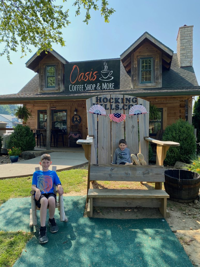 Two boys outside of Oasis Coffee Shop & More in Rockbridge, Ohio.
