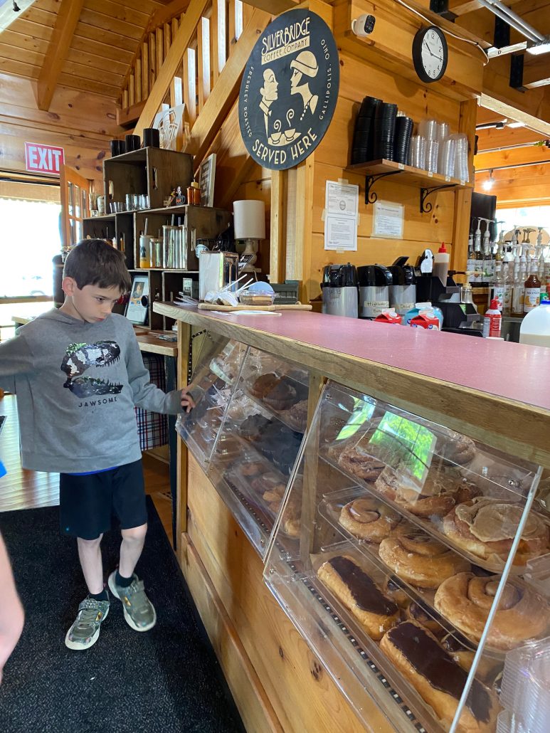 A boy looking at donuts at Oasis Coffee Shop in Hocking Hills.