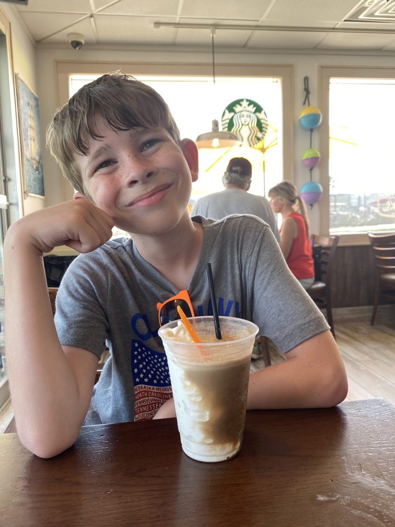 A boy eating a root beer float at the Dairy Isle on Put-in-Bay.