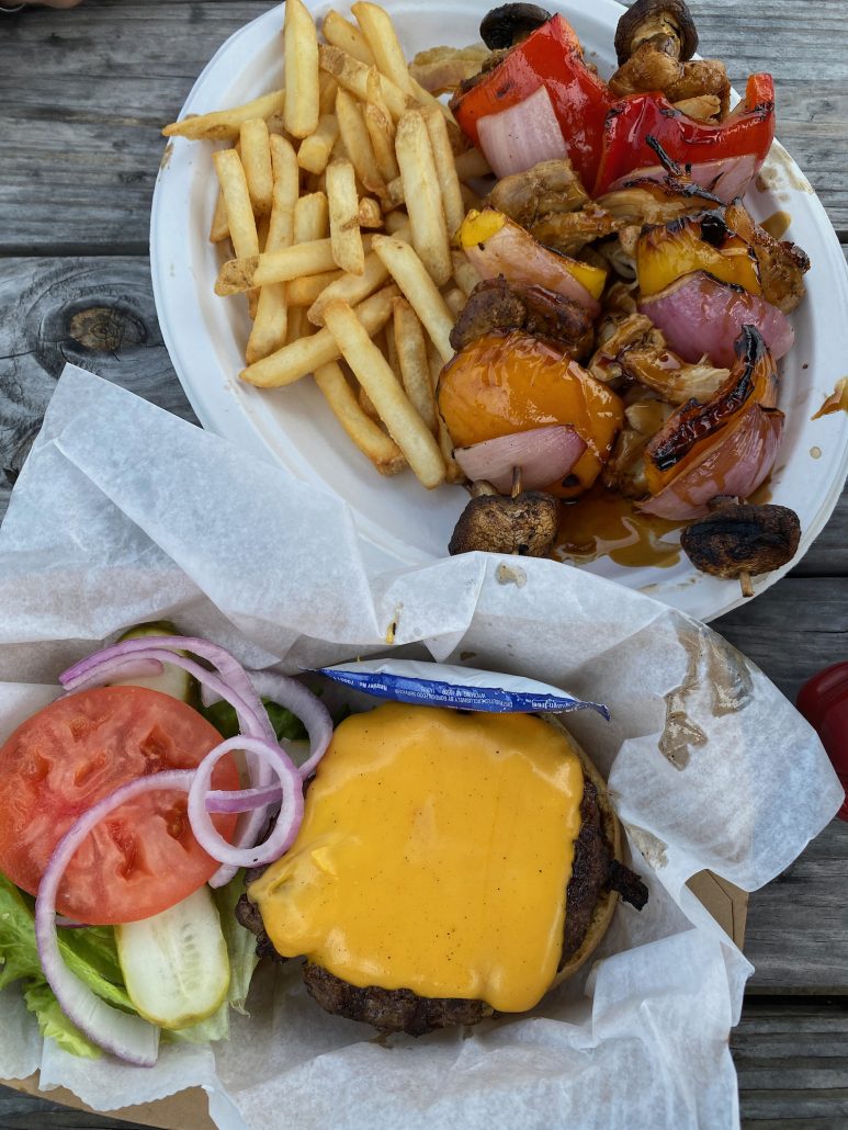A hamburger and kabob with fries at West Bay Inn.