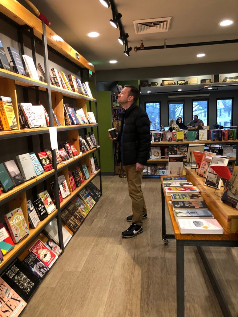 A man looking at books at a bookstore in the Tremont neighborhood of Cleveland.