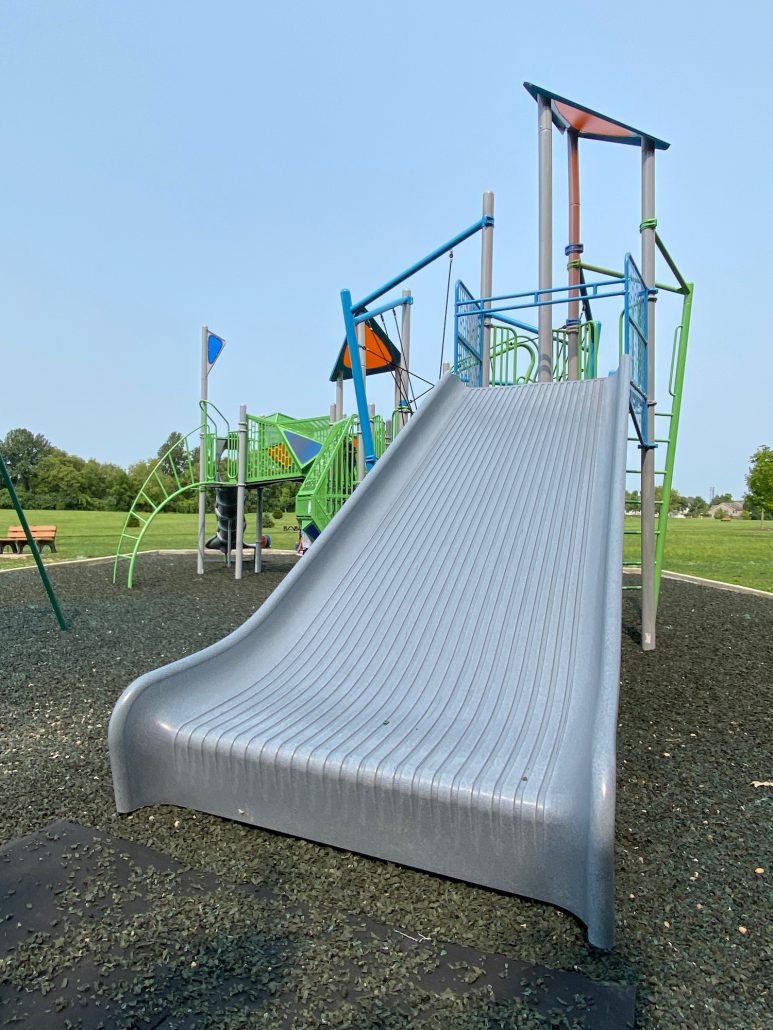 A wide, grey slide at Henceroth Park in Grove City.