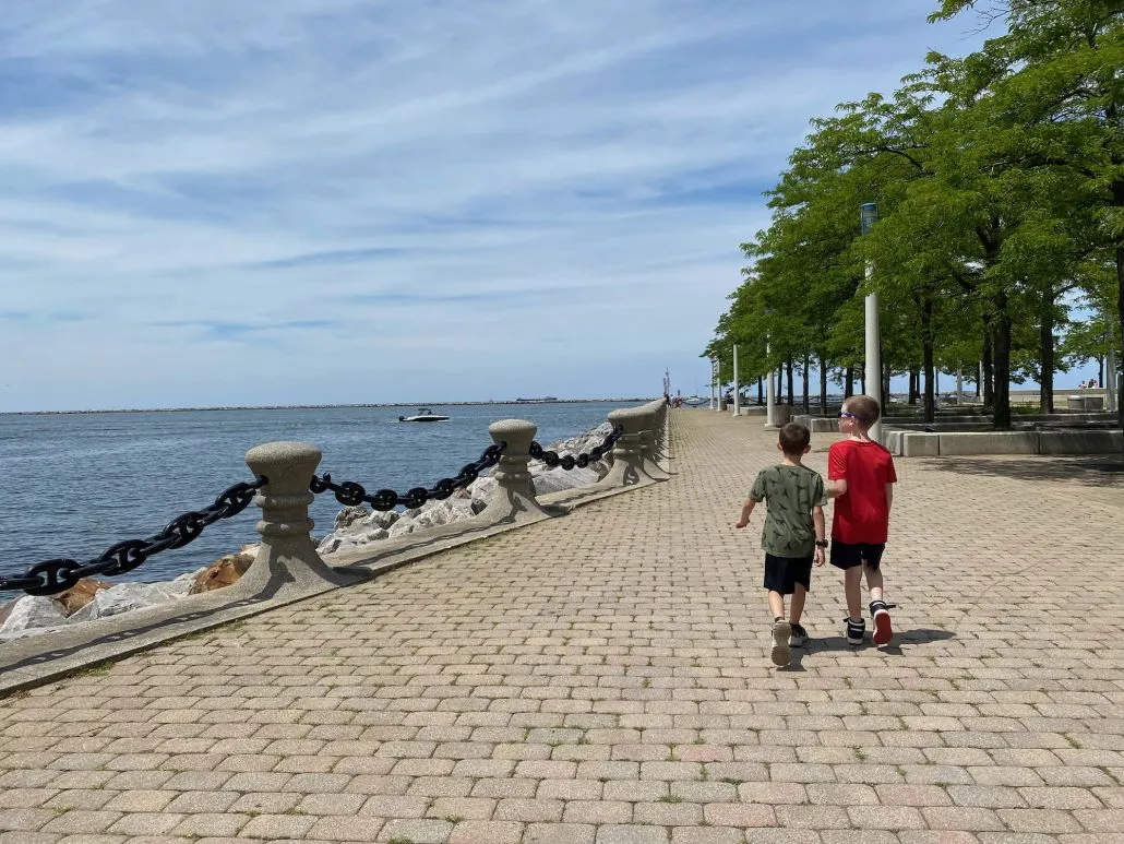 Two boys walking along Lake Erie at a park on North Coast.