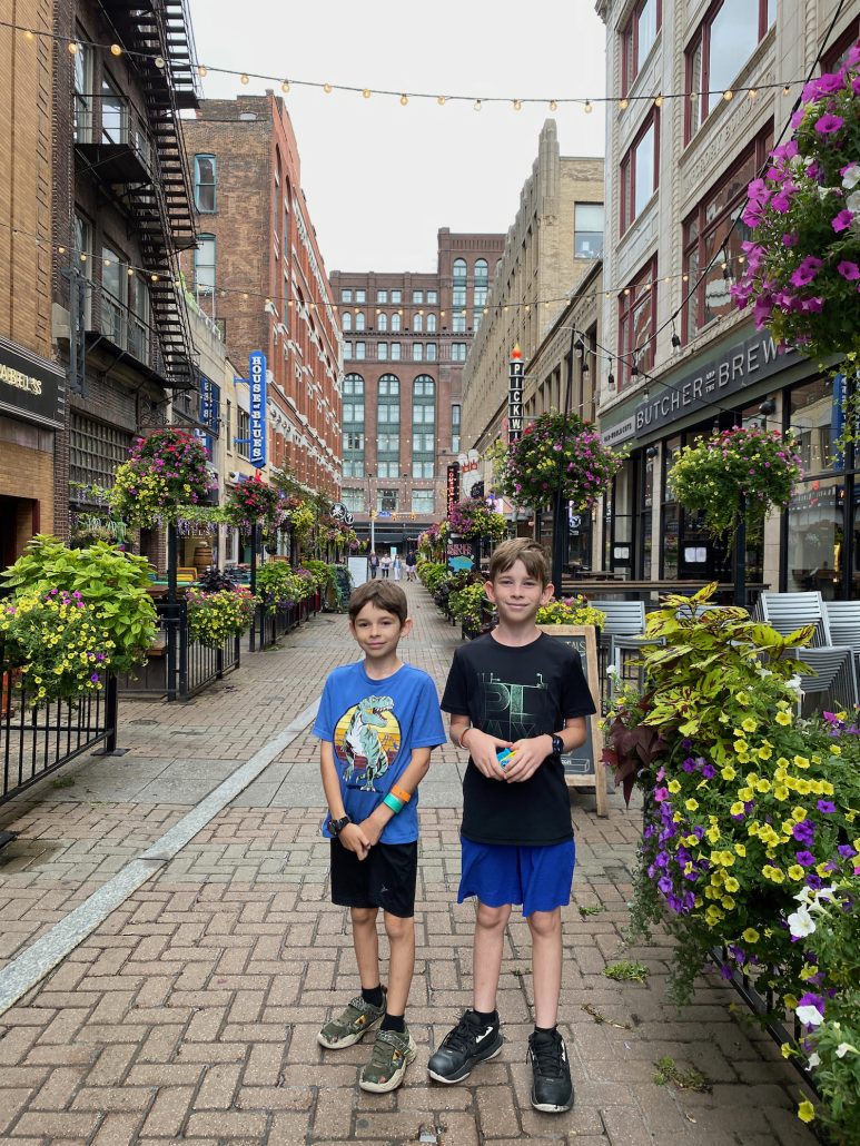 Two boys standing in the East 4th District in Cleveland, Ohio.