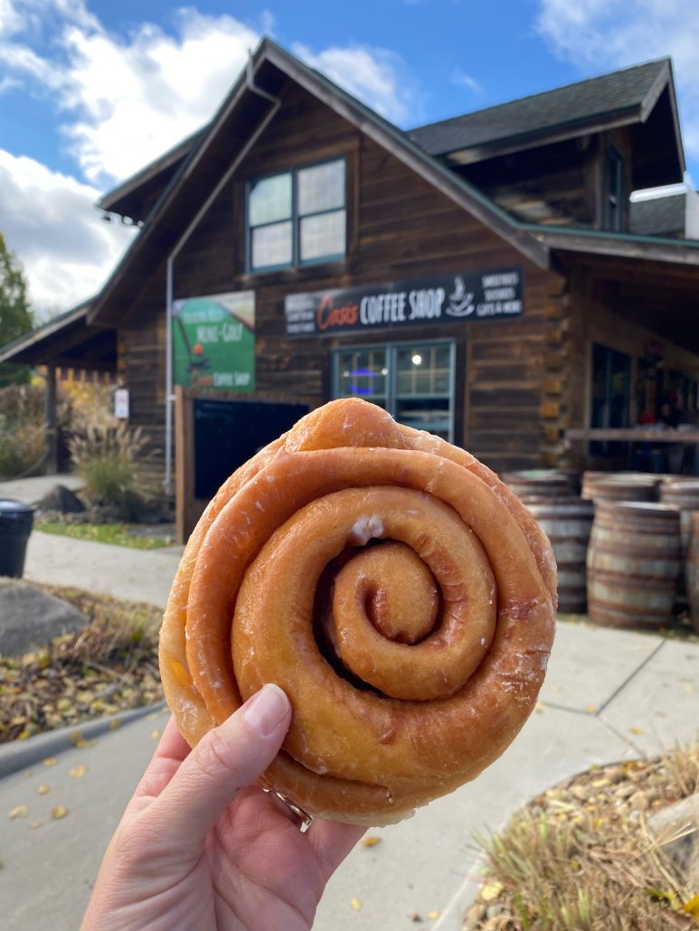 A cinnamon roll in front of Oasis Coffee Shop near Hocking Hills.