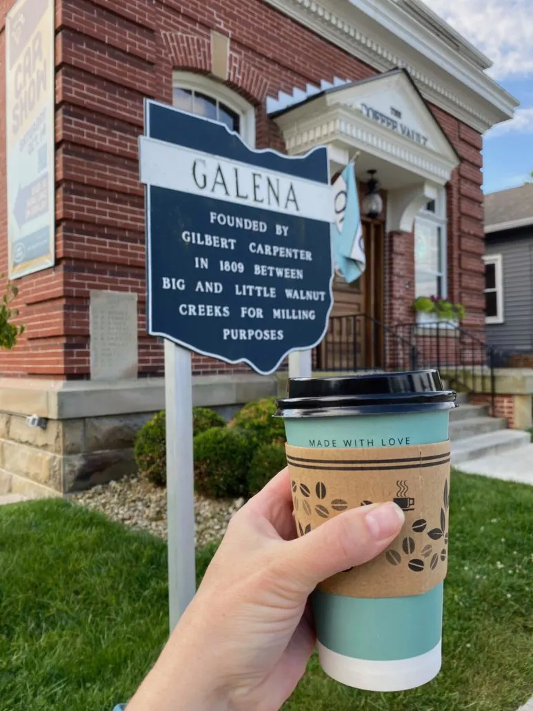 A cup of coffee in front of The Coffee Vault in Galena, Ohio.