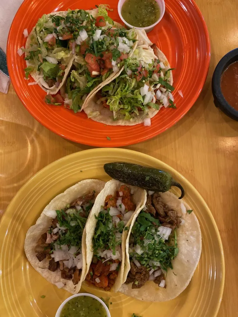 Traditional tacos and Dos Hermanos tacos on a table at Dos Hermanos at Easton Town Center.