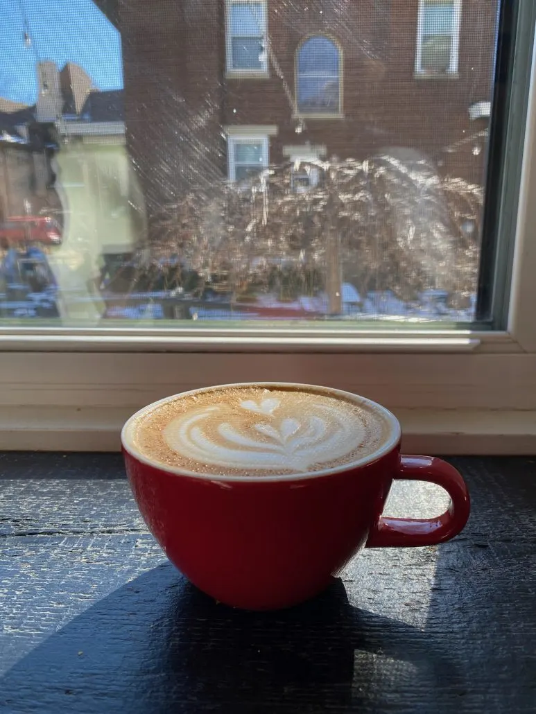 A latte sitting on the counter at Mom 'n 'em Coffee shop in Cincinnati, Ohio.