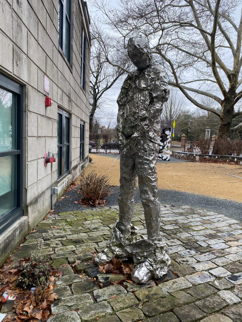 A statue of a man peeing at Columbus Museum of Art at The Pizzuti.