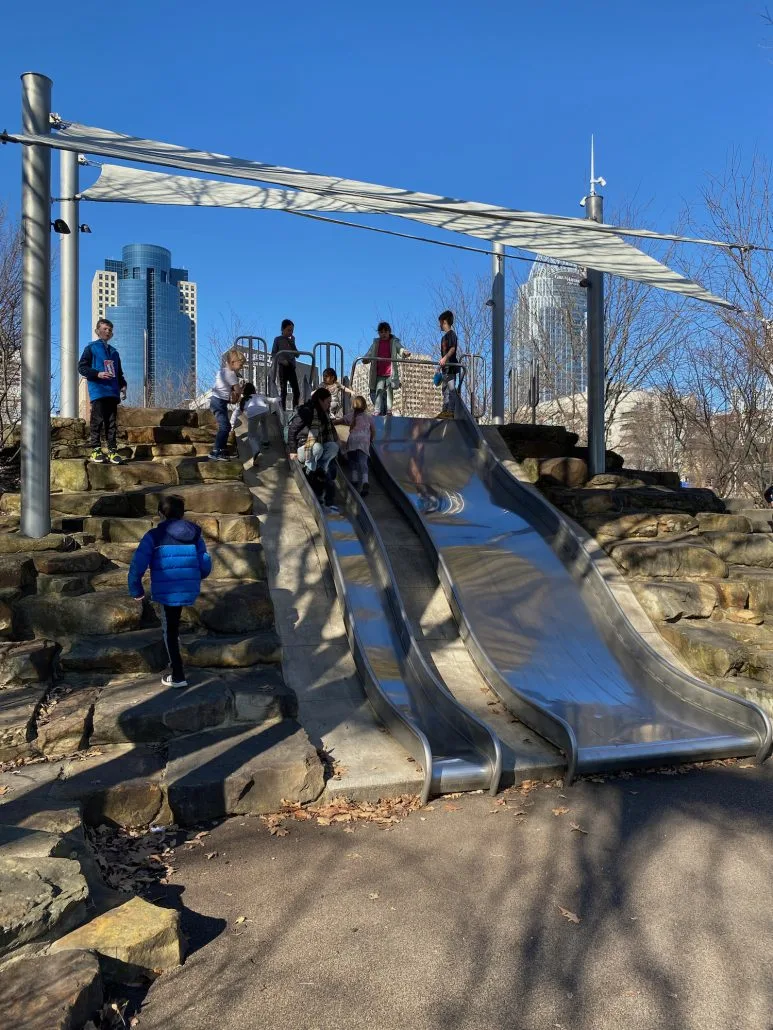 Kids on tall slides at the Smale Riverfront Park in Cincinnati.