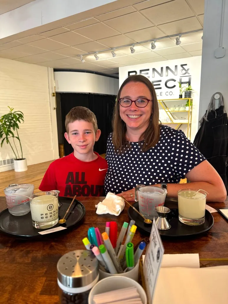 A mom and son pouring candles at Penn & Beech in Grandview Heights.