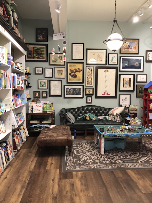 A couch and bookshelves inside Cover to Cover Bookstore in Upper Arlington.