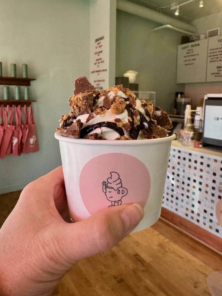 Soft serve ice cream topped with reese cups at coffee + cone in Upper Arlington.