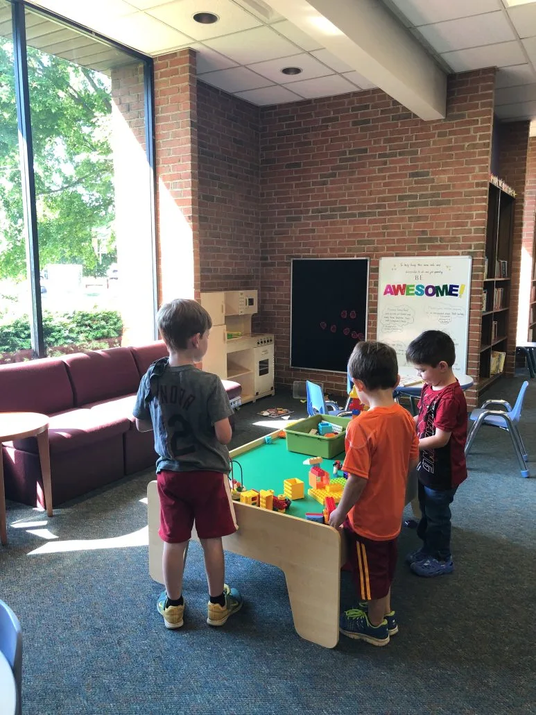 Boys playing at a train table at the Tremont Library in Upper Arlington.