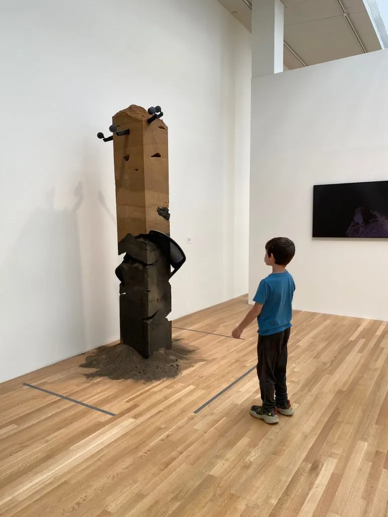 A boy looking at a sculpture at The Wexner Center for the Arts in Columbus, Ohio.