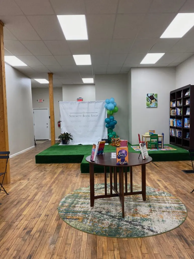 A stage and children's book area at Serenity Book Shop in Grandview.