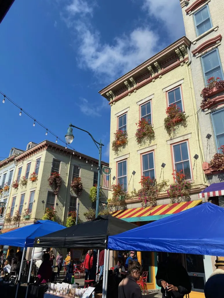 Tents and flowers in window boxes at Findlay Market.