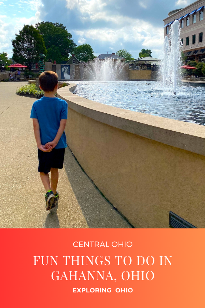 Boy walking along a fountain at the Creekside District in Gahanna, Ohio.