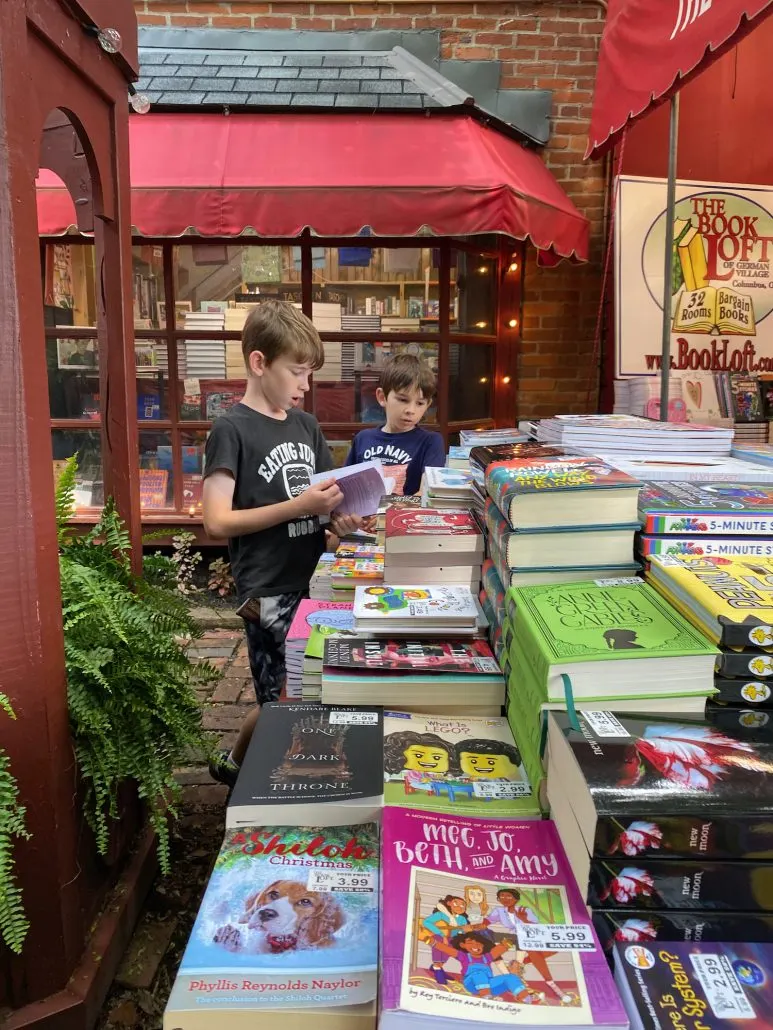 Two boys looking at books at the Book Loft in German Village, Columbus.