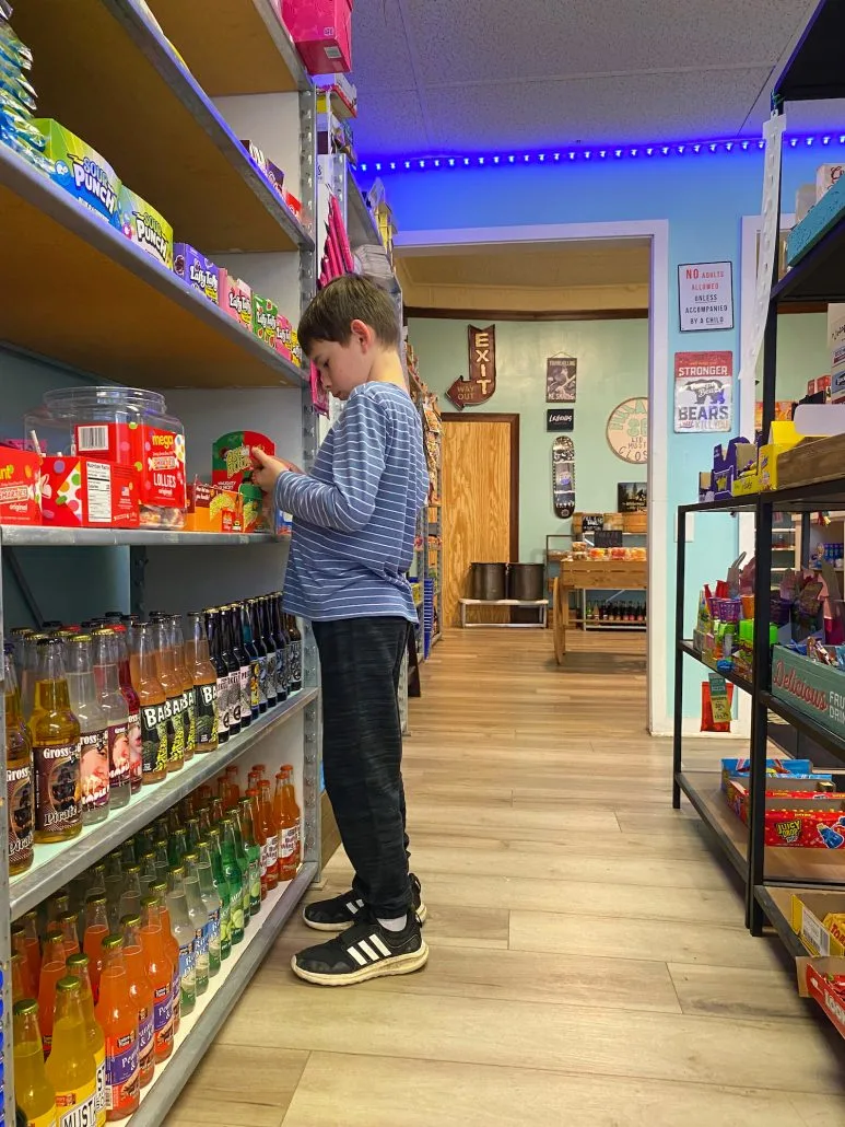 A boy looking at candy at Strawser’s Ice Cream, Pop & Candy Shop in Grove City, Ohio.