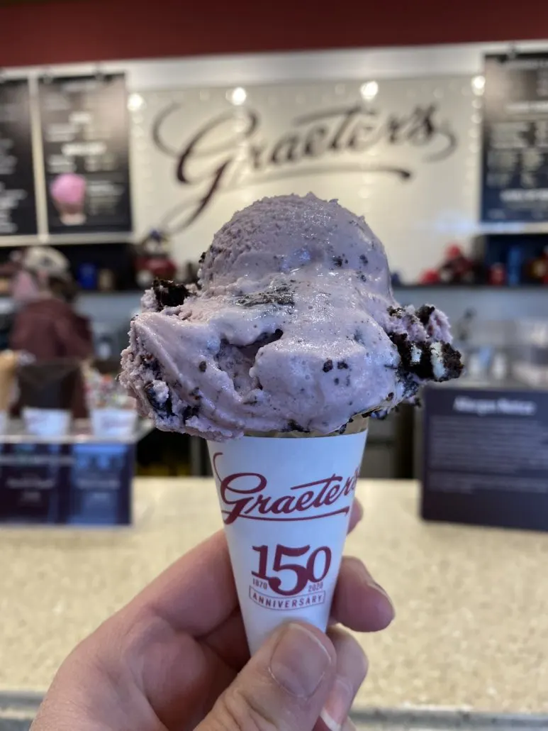A sugar cone with one scoop of ice cream on top at Graeter's Ice Cream in Columbus Oh.