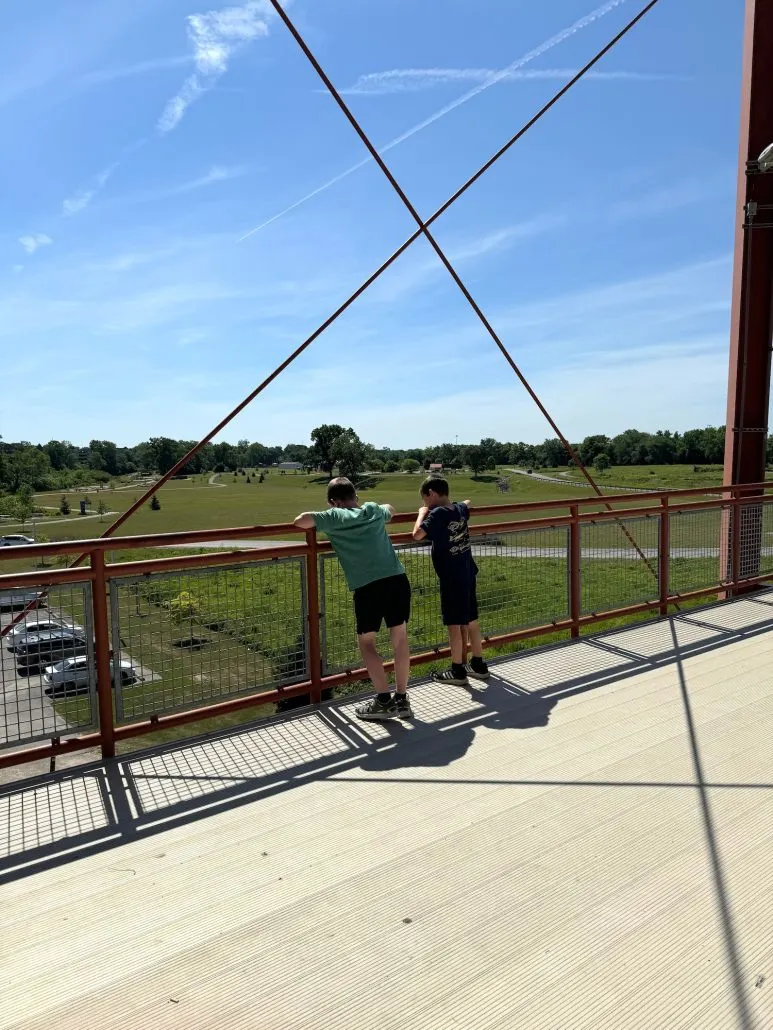 Two boys overlooking the park from the water tower at Scioto Audubon Metro Park.