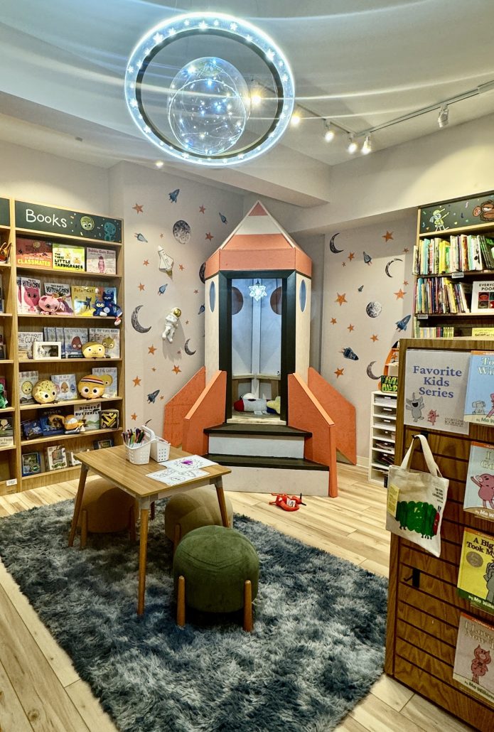 The children's area with a rocket reading nook at Storyline Bookshop in Upper Arlington, Ohio.