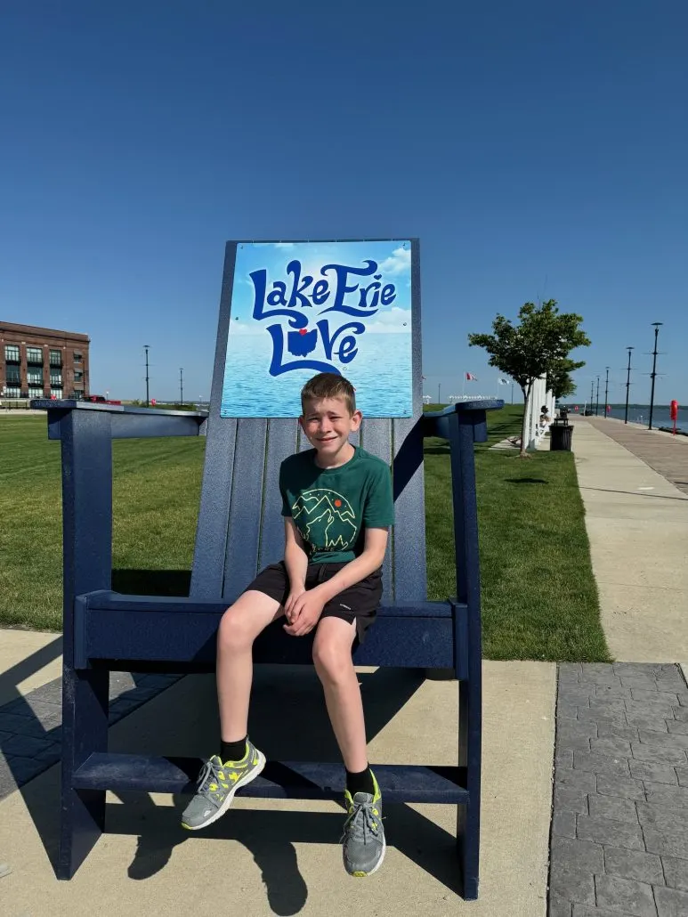 A boy on a chair at Jackson Street Pier in Sandusky, Ohio.