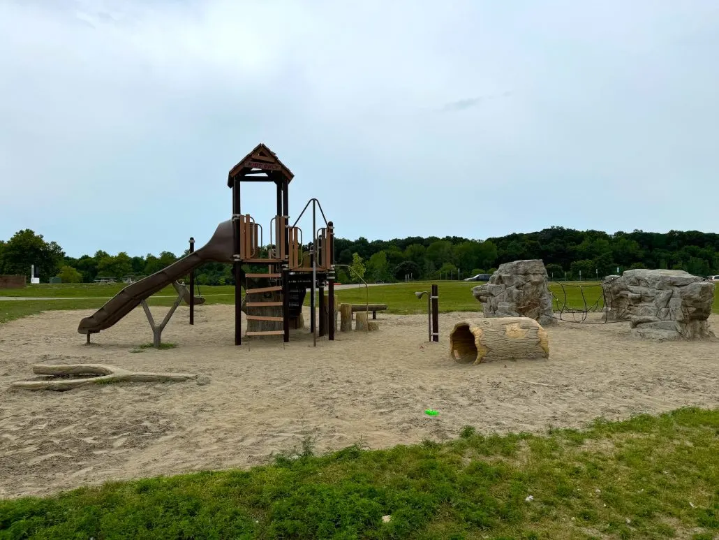 The southernmost playground at Alum Creek State Park Beach with wooden play structures and climbing walls.