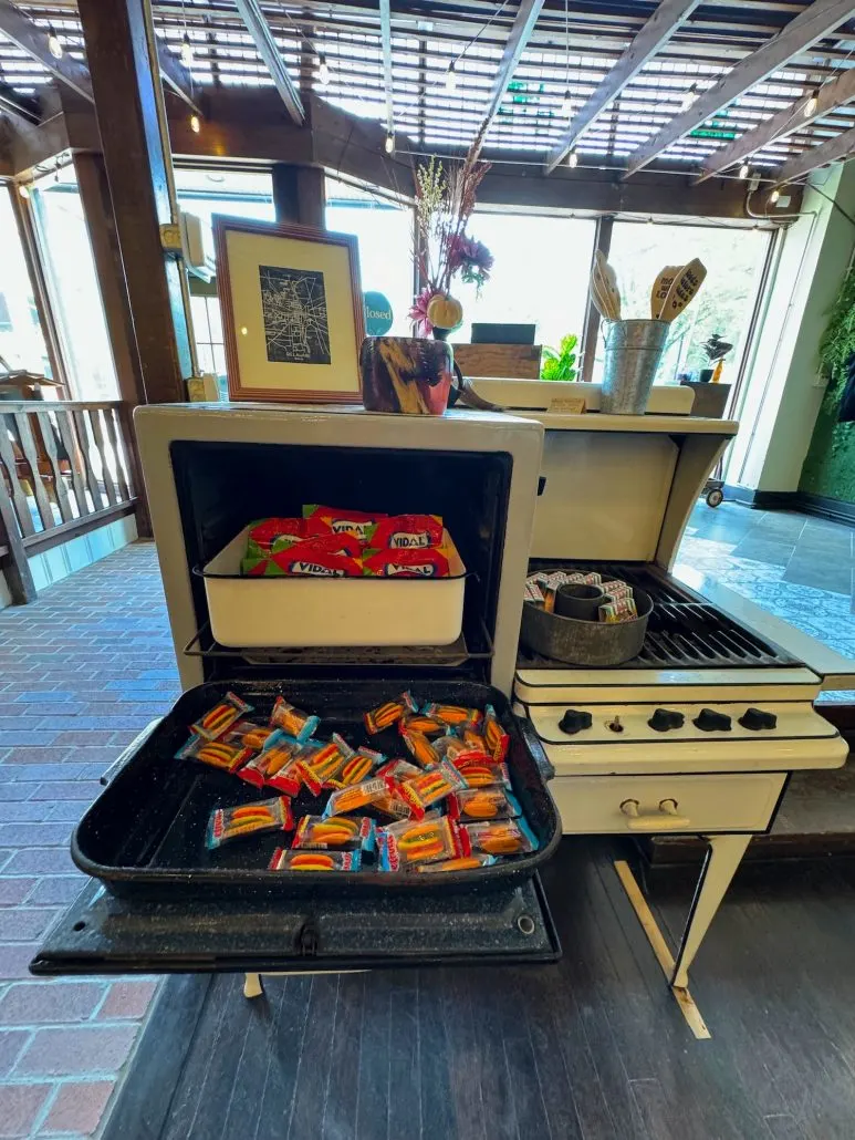 Candy for sale, stored on a vintage stove.