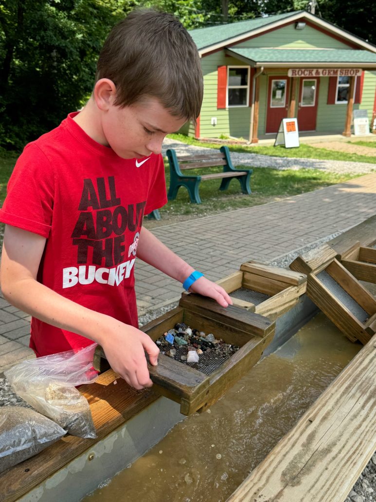 A boy mining for gems at Olentangy Caverns.