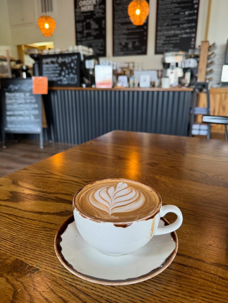 Lydia's Latte sitting on a table at Red Hen Cafe.