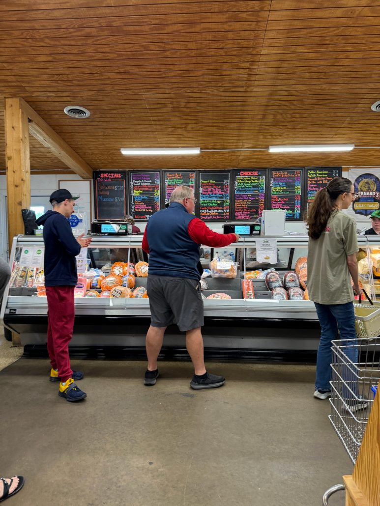 People in line at the deli counter at Yutzy's Farm Market in Plain City, Ohio.