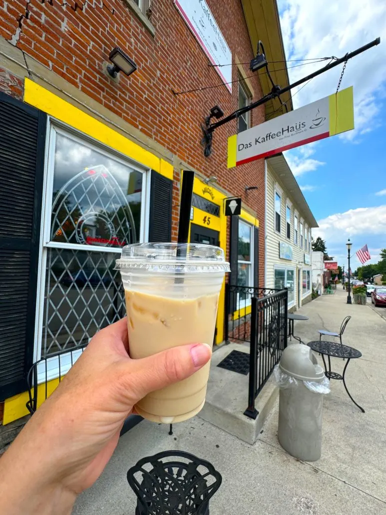 An iced latte held up outside of the door of Das KaffeeHaus in Lithopolis, Ohio.