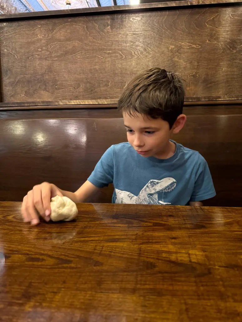 Boy playing with Pizza Dough at Six Hundred Downtown.