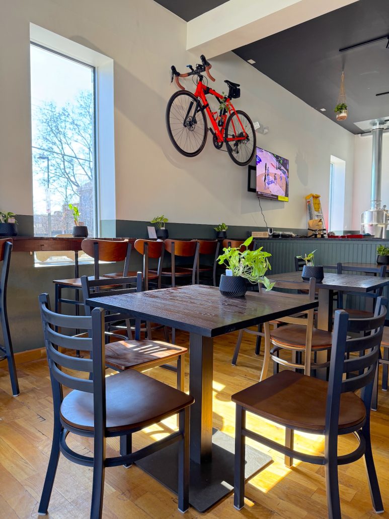 A seating area with tables and bar seating at Jennings Java in Merion Village.